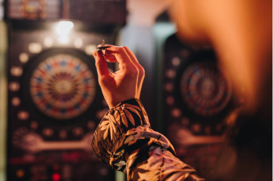 When a dart board is placed under strong
