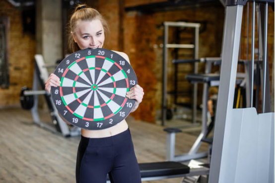 female gamers in the dart board 
