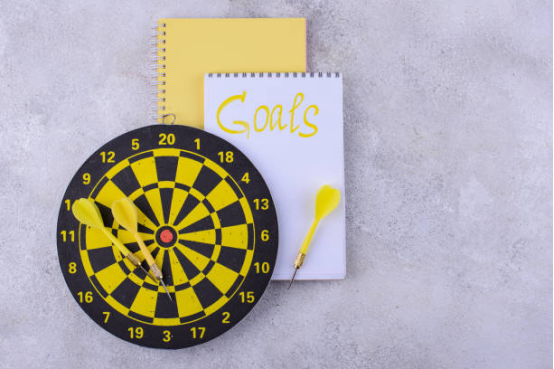 Organized dart training space with board, darts, and score tracking