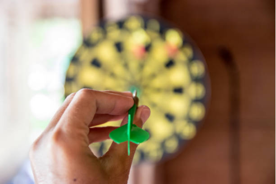 Close-up of a dart hitting the "bullseye" area with guide stickers