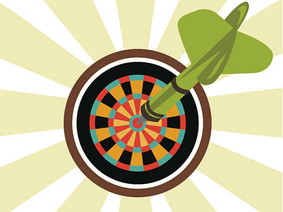 Dart thrower focusing on marked target zone with clear stickers