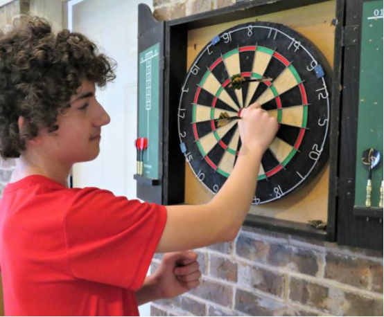 Dartboard stand showing slight wobble, disrupting stability