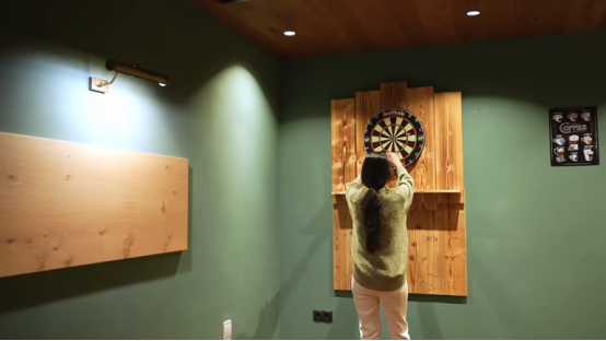 dart board mounted at proper height on home wall