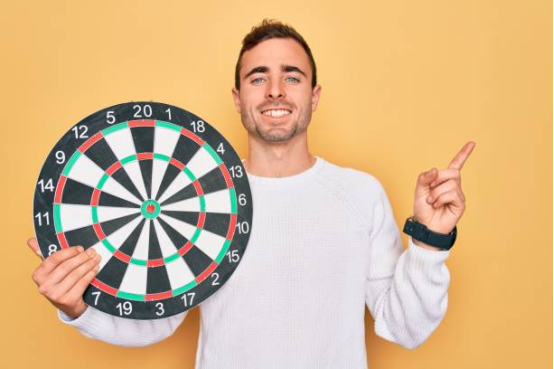 Worn dart board surface showing uneven fiber density