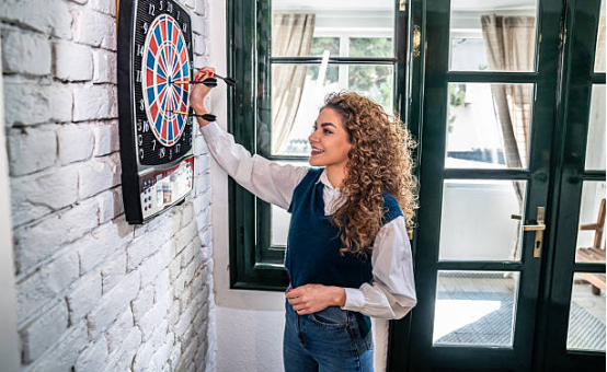 Adjusting Dart board position in dedicated home training space