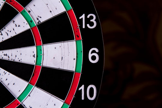 Extreme close-up of a dart board segment showing numbers 13, 6, and 10.