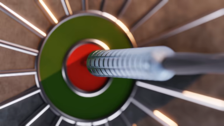Dart hitting the red bullseye of a modern dart board.